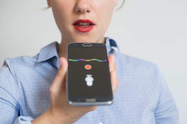 woman talking to smart device